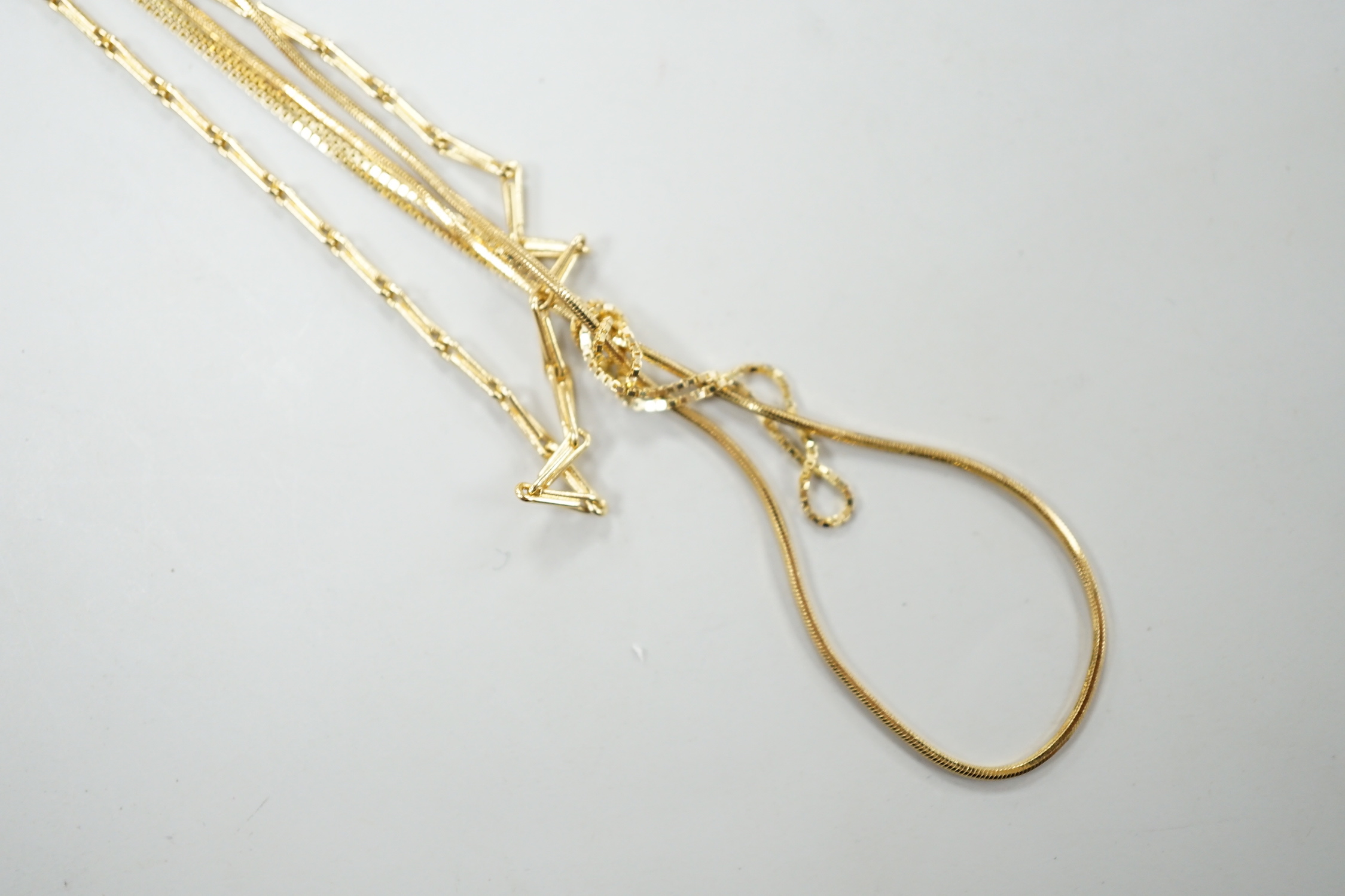 An 18ct gold fine baton link chain, 38cm and one other 750 chain, 7.3 grams and one 14kt chain, 0.9 grams.